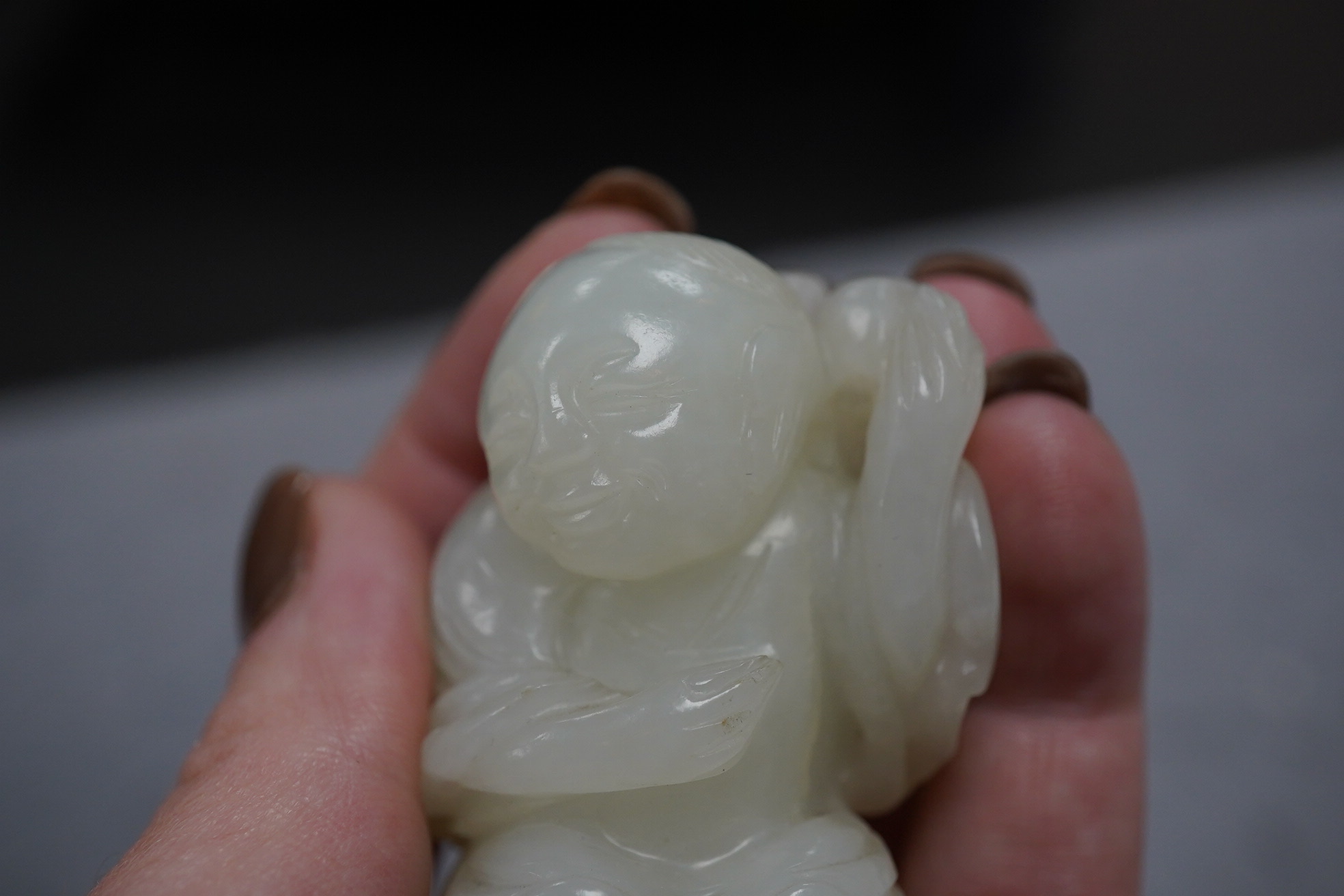 A Chinese white jade figure of Liu Hai, 18th-19th century